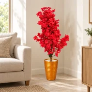 Arbre artificiel à fleurs rouges avec pot orange métallisé dans un coin de salon – Plantora